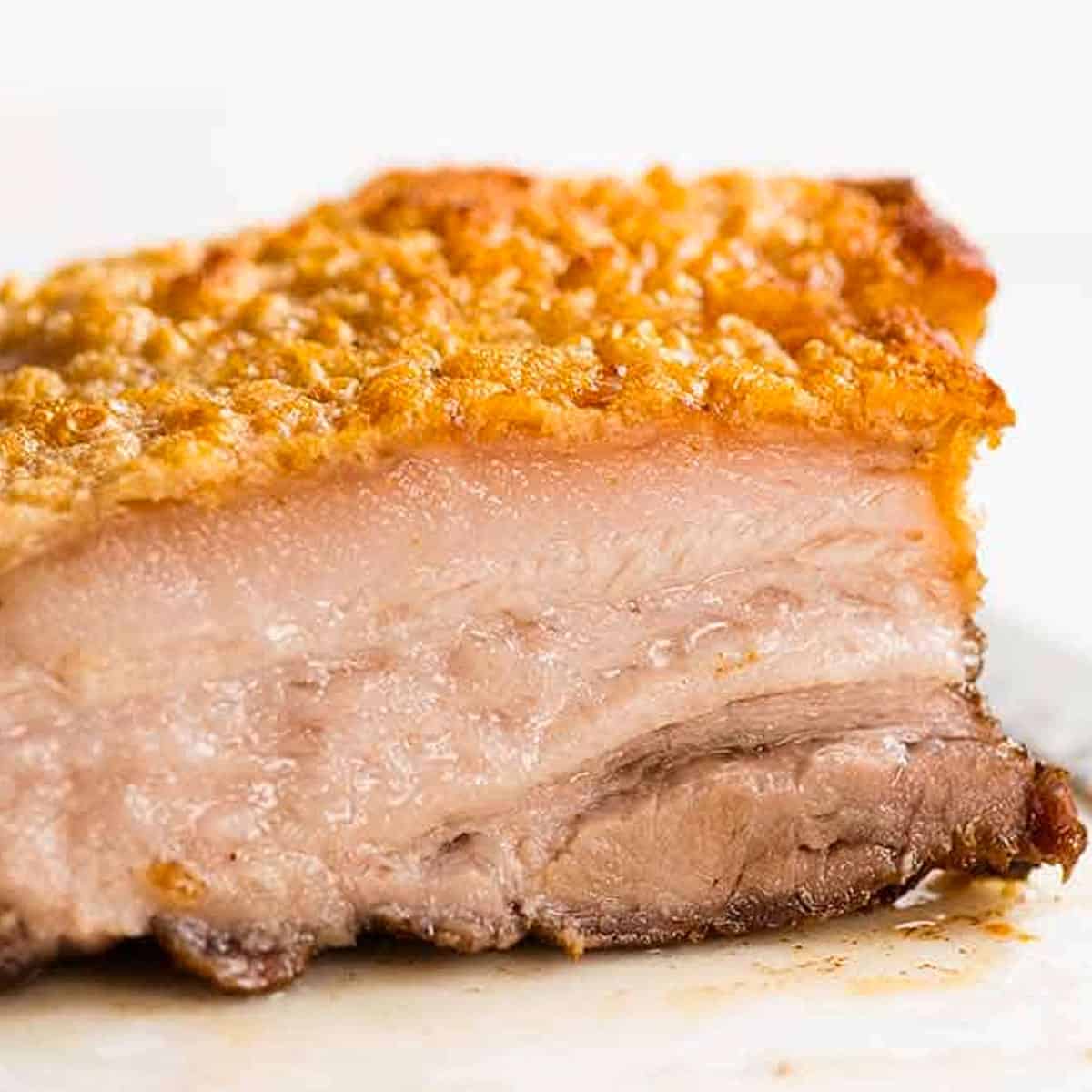 Crispy Pork belly with juicy seasoned meat and the crunchiest crackling mak...